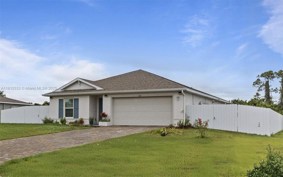 Front exterior of a new home in , Labelle, FL, highlighting curb appeal (Image 21).