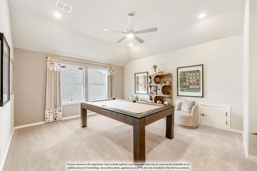 Game room with pool table, vaulted ceiling, ceiling fan, and carpet flooring Game room with pool table, vaulted ceiling, ceiling fan, and carpet flooring