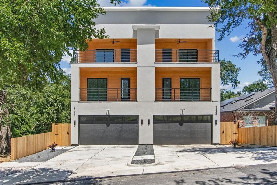 Contemporary house featuring a garage and a balcony