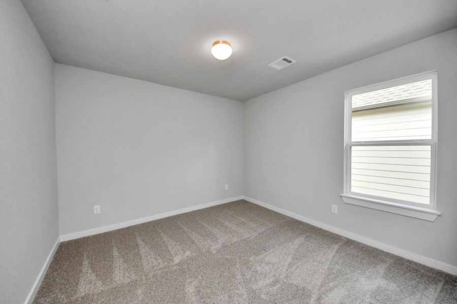 Secondary bedroom features plush carpeting, large windows that let in plenty of natural light, bright paint, and spacious closets. Secondary bedroom features plush carpeting, large windows that let in plenty of natural light, bright paint, and spacious closets.