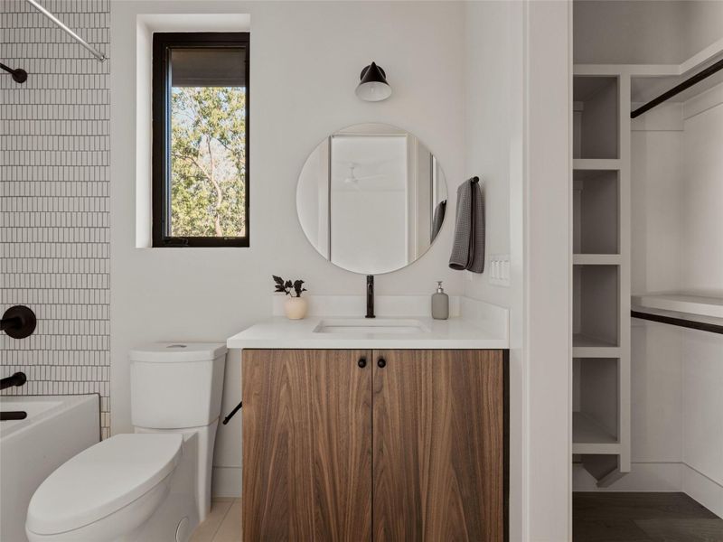 Full bathroom with vanity, bathtub / shower combination, and light tile patterned flooring