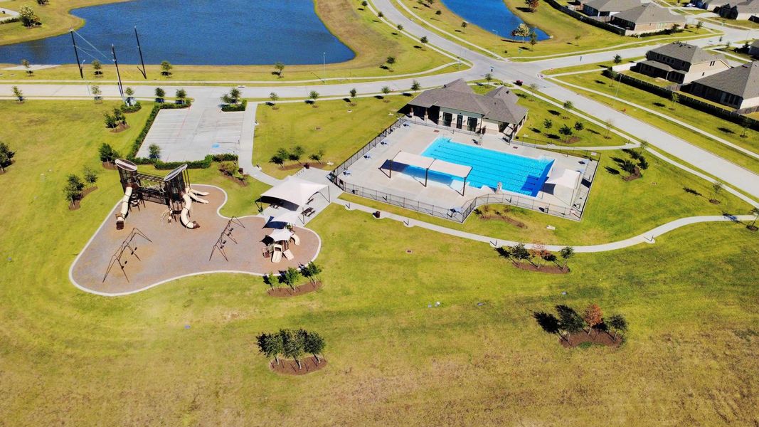 Fun for all ages — a sparkling backyard pool paired with a play area for kids, entertaining, and relaxation