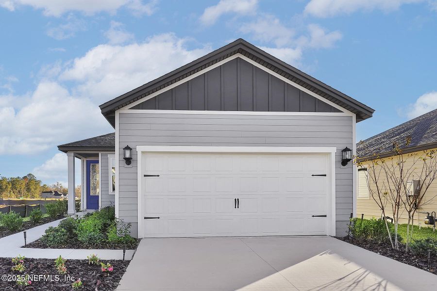 Front exterior of a new home in Jennings Farm, Middleburg, FL, highlighting curb appeal (Image 1).