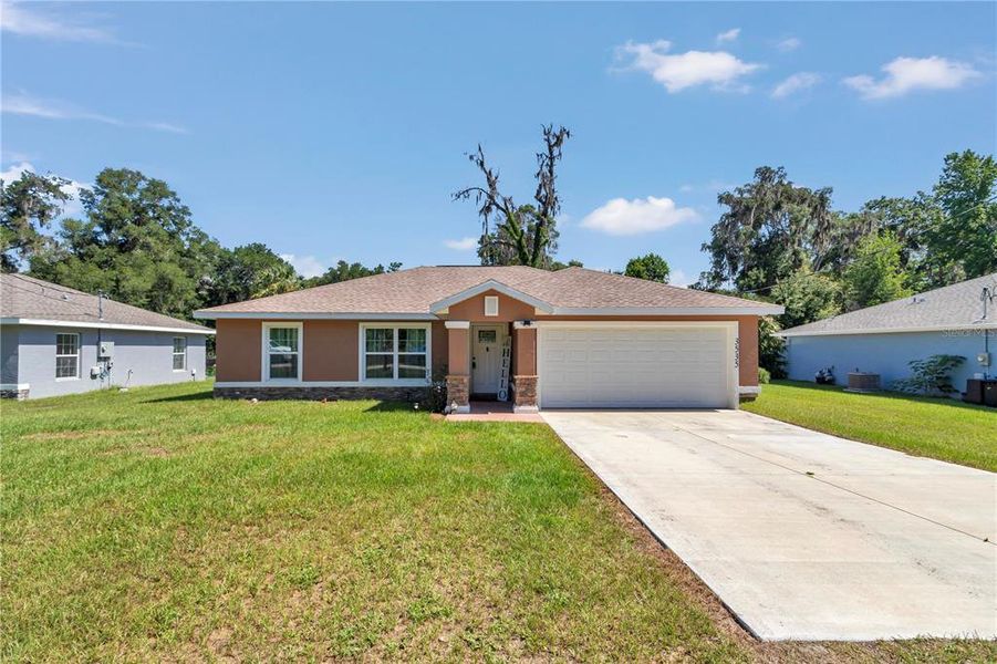 Front exterior of a new home in , Belleview, FL, highlighting curb appeal (Image 1). Front exterior of a new home in , Belleview, FL, highlighting curb appeal (Image 1).