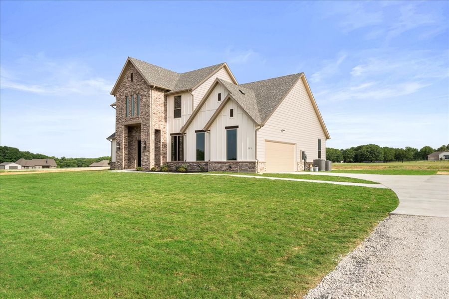 Front exterior of a new home in Spring Valley Ranch, Paradise, TX, highlighting curb appeal (Image 2).