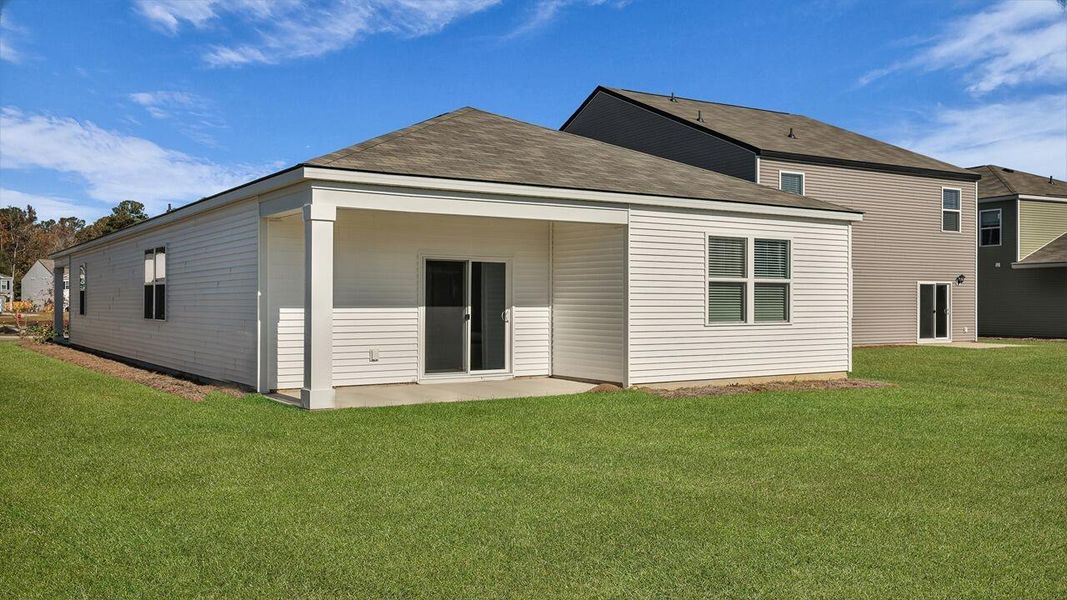 Exterior details and patio area of a home in Pine Hills at Cane Bay, Summerville (Image 24).