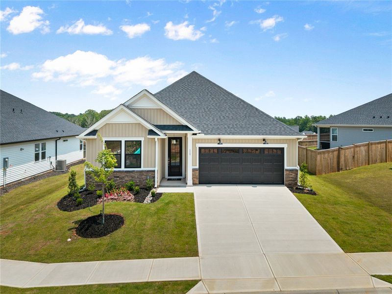 Well-maintained lawn and landscaping frame this ch Well-maintained lawn and landscaping frame this ch