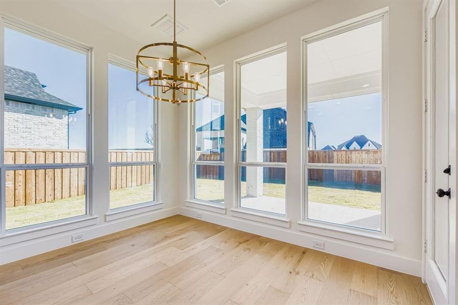 Unfurnished dining area featuring light wood-type flooring