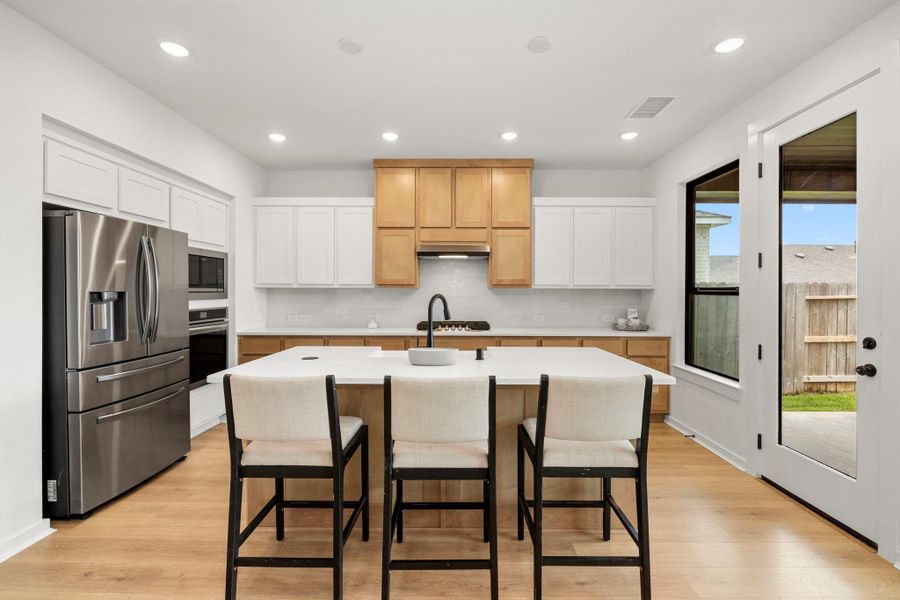 The kitchen is well lit and shares plenty of natural light.
