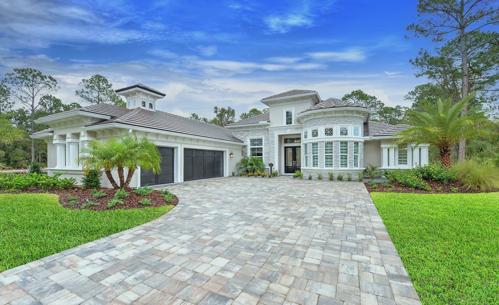 Front exterior of a new home in The Reserve at Plantation Bay, Bunnell, FL, highlighting curb appeal (Image 2). Front exterior of a new home in The Reserve at Plantation Bay, Bunnell, FL, highlighting curb appeal (Image 2).