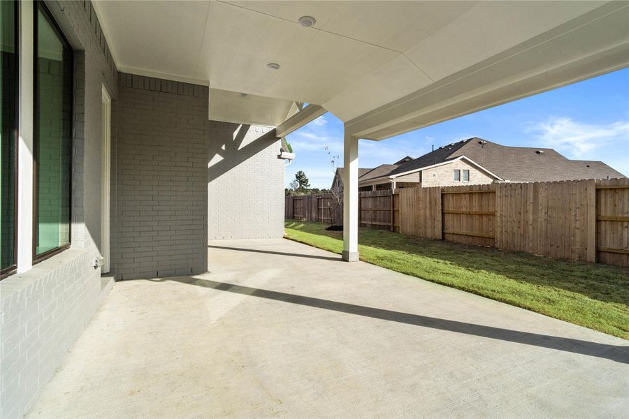 Step outside to the covered rear patio, the perfect extension of your indoor living space for year-round enjoyment. Step outside to the covered rear patio, the perfect extension of your indoor living space for year-round enjoyment.