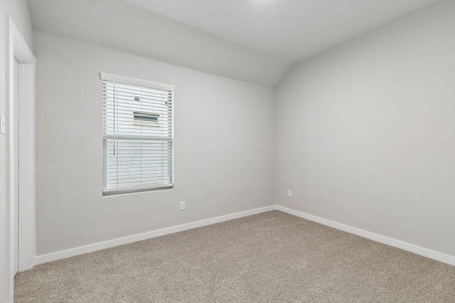Bedroom in the Emmy II home plan by Trophy Signature Homes - REPRESENTATIVE PHOTO