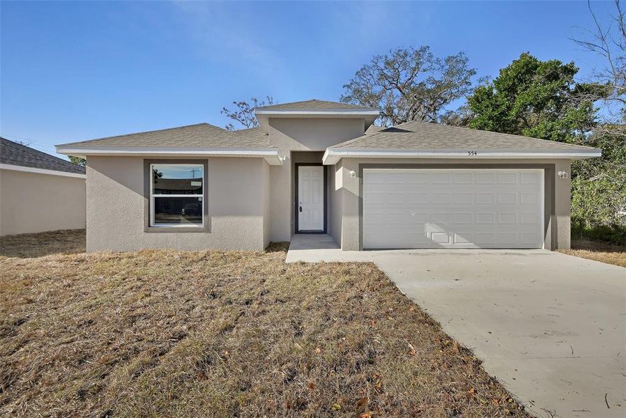 Front exterior of a new home in , Daytona Beach, FL, highlighting curb appeal (Image 1). Front exterior of a new home in , Daytona Beach, FL, highlighting curb appeal (Image 1).