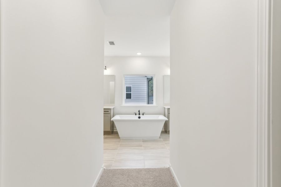 Representative furnished interior of a home built from the Alexis by Ashton Woods in Rowland's Grant, Fuquay Varina (Image 29).