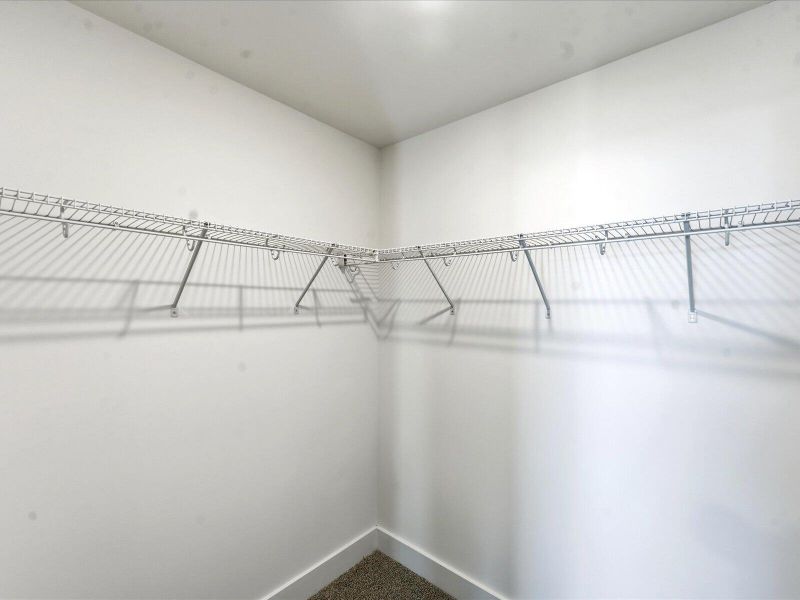 Spacious, unfurnished interior of a new home in The Coves at Lakes of Cane Bay II, Summerville (Image 22).