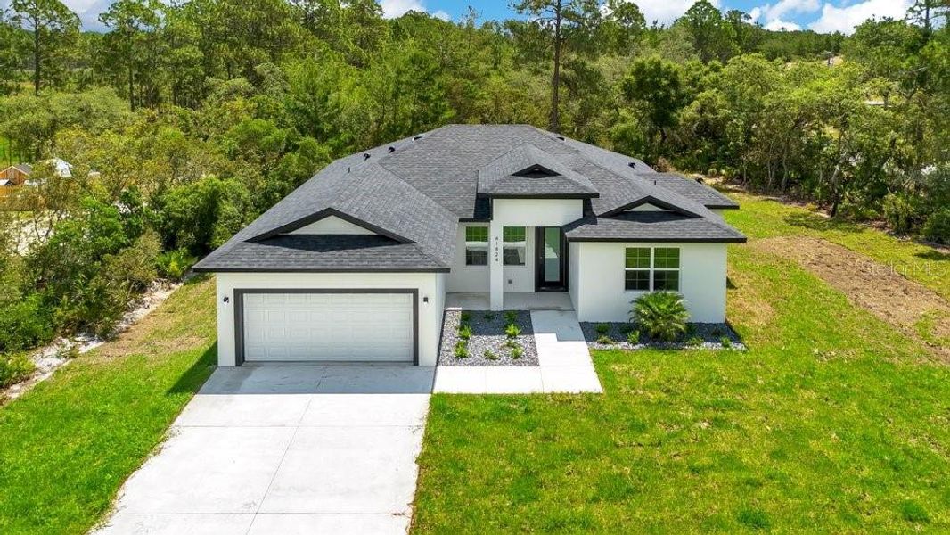 Front exterior of a new home in , Eustis, FL, highlighting curb appeal (Image 19).