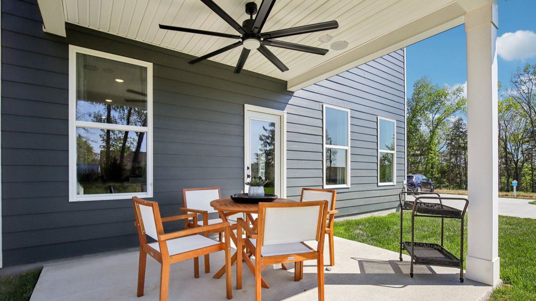Outdoor living at its finest with covered seating are with fan