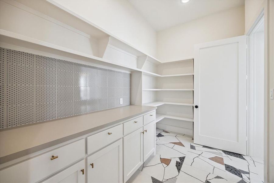 Not that you don't already have ample storage space in the kitchen, this home also features a walk-in pantry, providing even more room for all your culinary essentials.