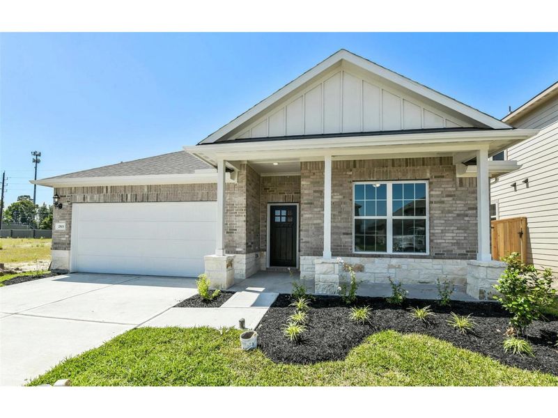 Front exterior of a new home in Sundance Cove, Crosby, TX, highlighting curb appeal (Image 1).