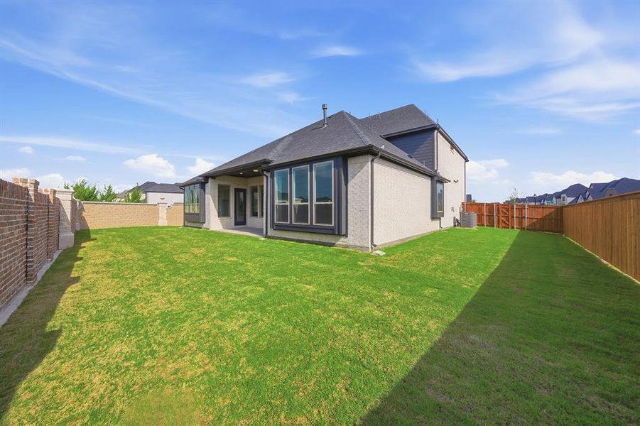 Exterior details and patio area of a home in Estates at Rockhill, Frisco (Image 3).