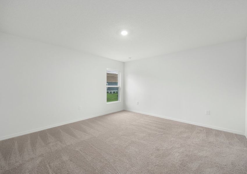 The master bedroom is spacious and has a walk in closet and bathroom attached