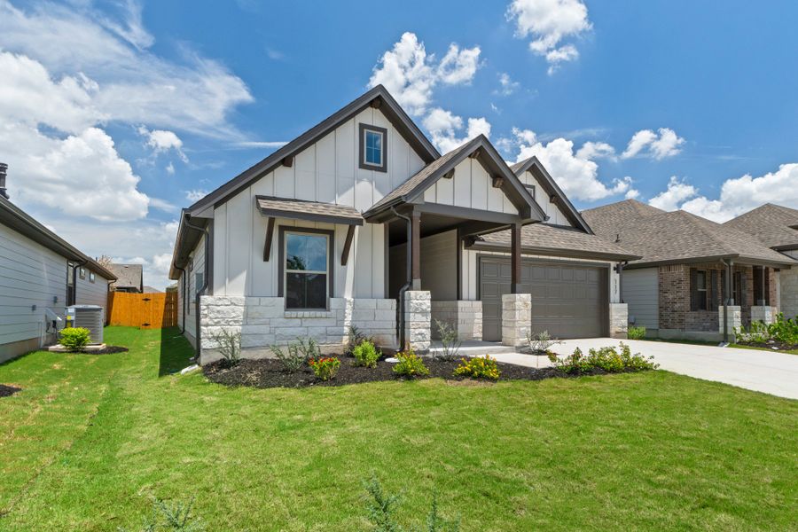 Front exterior of a new home in Prairie Winds, Hutto, TX, highlighting curb appeal (Image 2). Front exterior of a new home in Prairie Winds, Hutto, TX, highlighting curb appeal (Image 2).