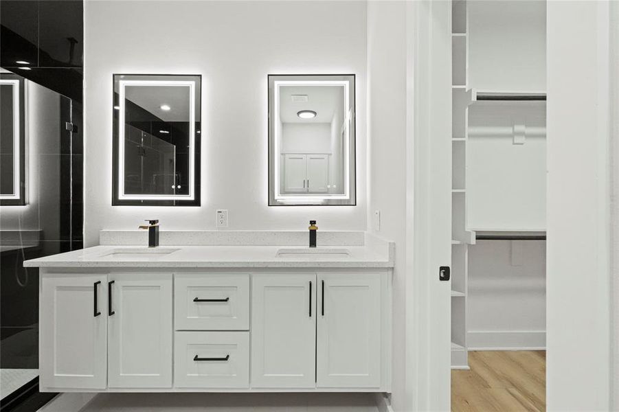 Bathroom with vanity and wood-type flooring