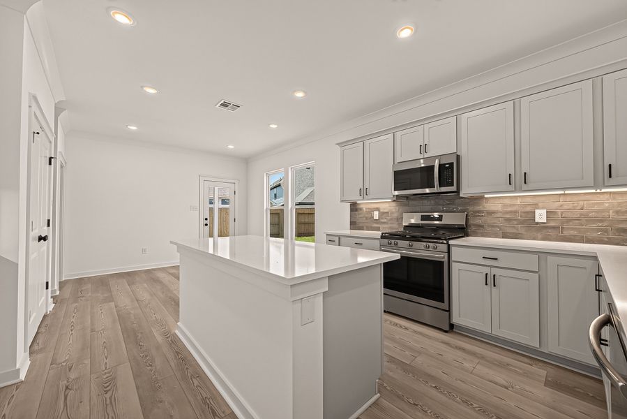Furnished interior view inside a new home in Aldeana, Bonney (Image 14).