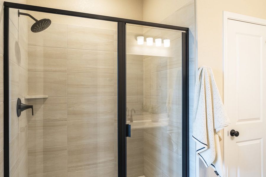 Optional walk-in shower with tile surround at primary bath