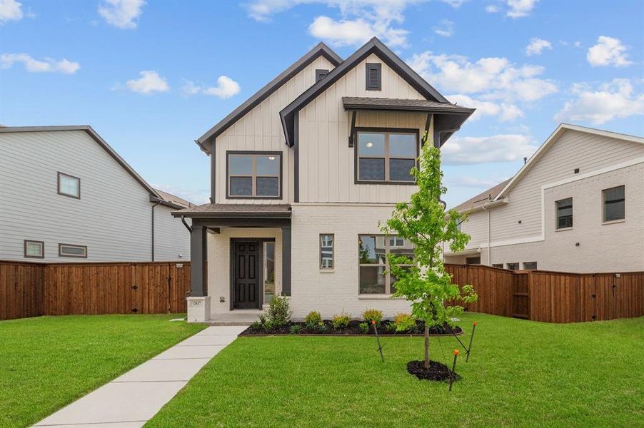Front exterior of a new home in Walsh Cottage, Fort Worth, TX, highlighting curb appeal (Image 2). Front exterior of a new home in Walsh Cottage, Fort Worth, TX, highlighting curb appeal (Image 2).