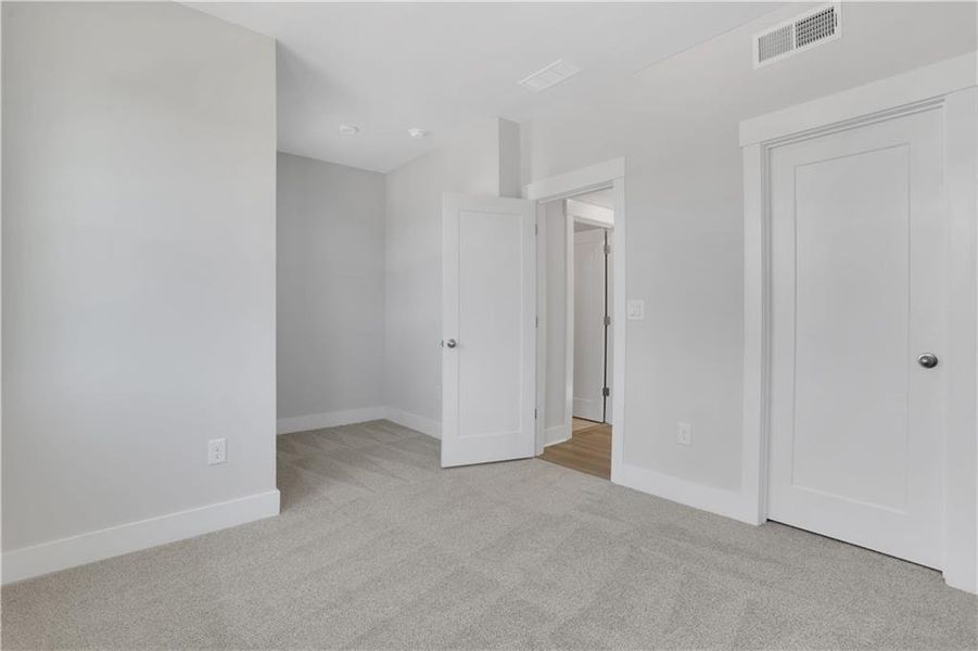Spacious, unfurnished interior of a new home in The Paddocks at Doc Hughes, Buford (Image 21).