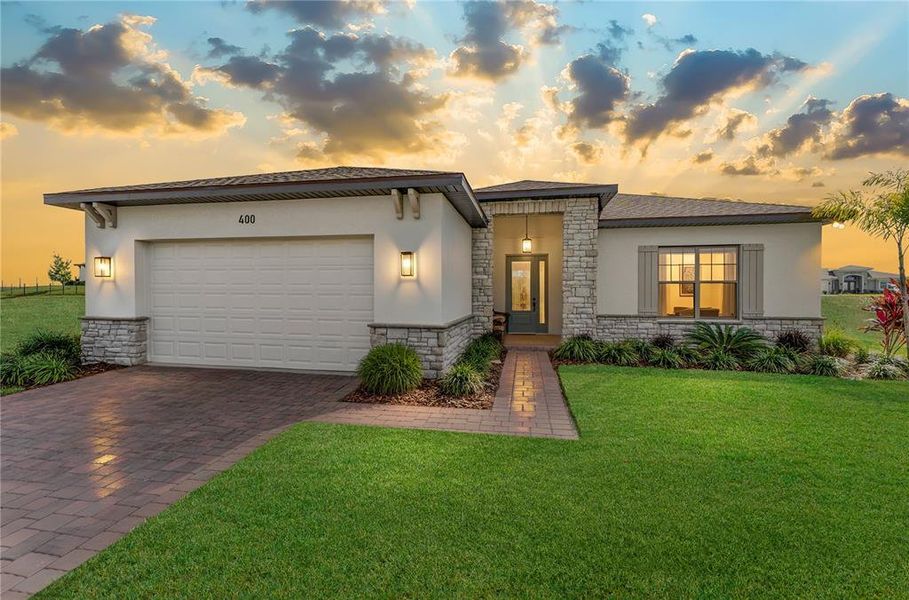 Front exterior of a new home in , Auburndale, FL, highlighting curb appeal (Image 24).