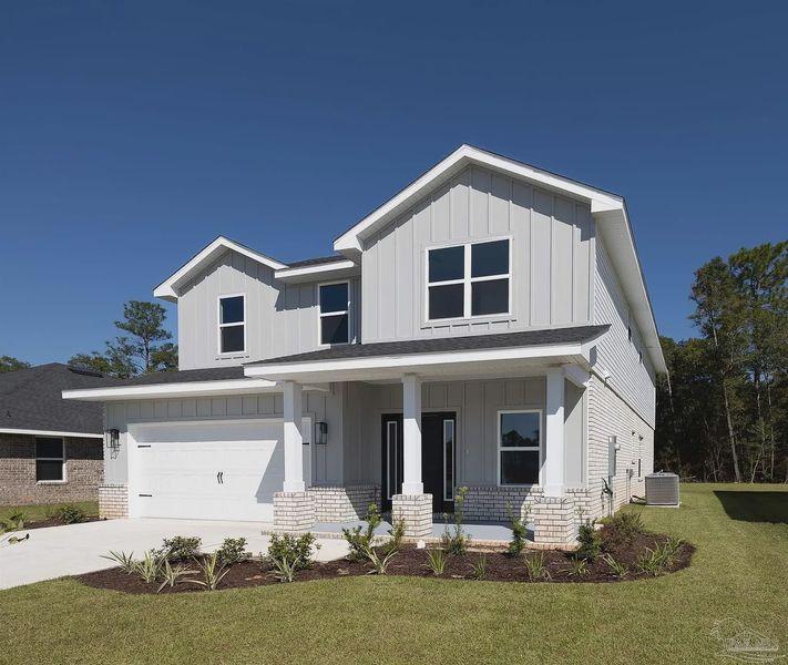Front exterior of a new home in Parkland Place, Pace, FL, highlighting curb appeal (Image 2). Front exterior of a new home in Parkland Place, Pace, FL, highlighting curb appeal (Image 2).