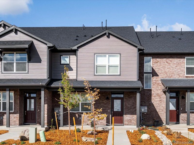 Front exterior of a new home in Horizon Uptown: The Meadow Collection, Aurora, CO, highlighting curb appeal (Image 2). Front exterior of a new home in Horizon Uptown: The Meadow Collection, Aurora, CO, highlighting curb appeal (Image 2).