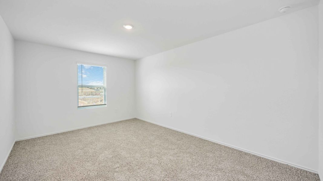 Representative unfurnished interior of a home built from the Franklin by D.R. Horton in Legacy Village, Houston (Image 11).