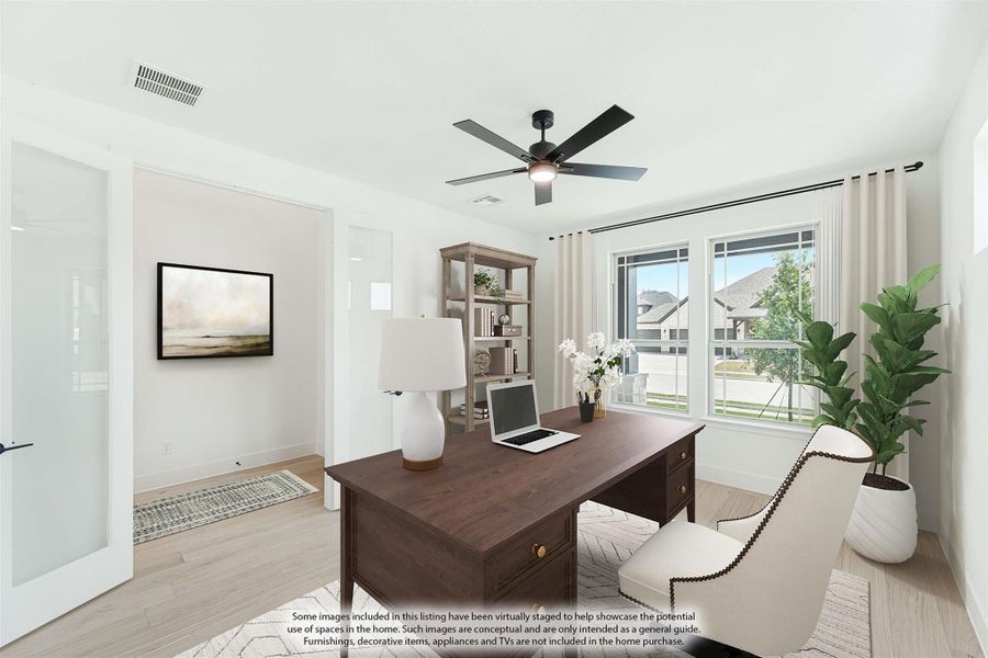 Home office with dark wood desk, ceiling fan, hardwood floors, and large windows with natural light Home office with dark wood desk, ceiling fan, hardwood floors, and large windows with natural light
