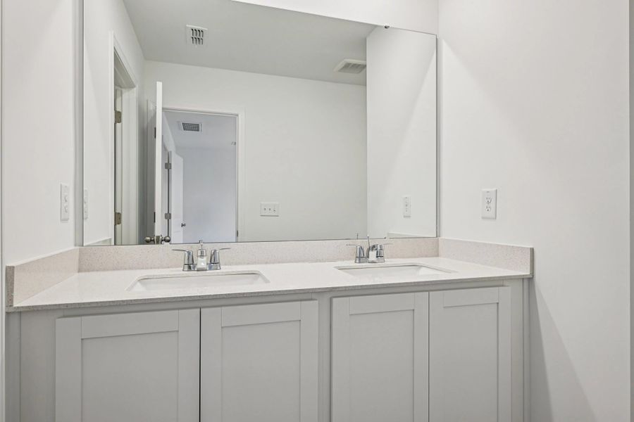 Primary Bath - Clean geometry and high-contrast finishes.