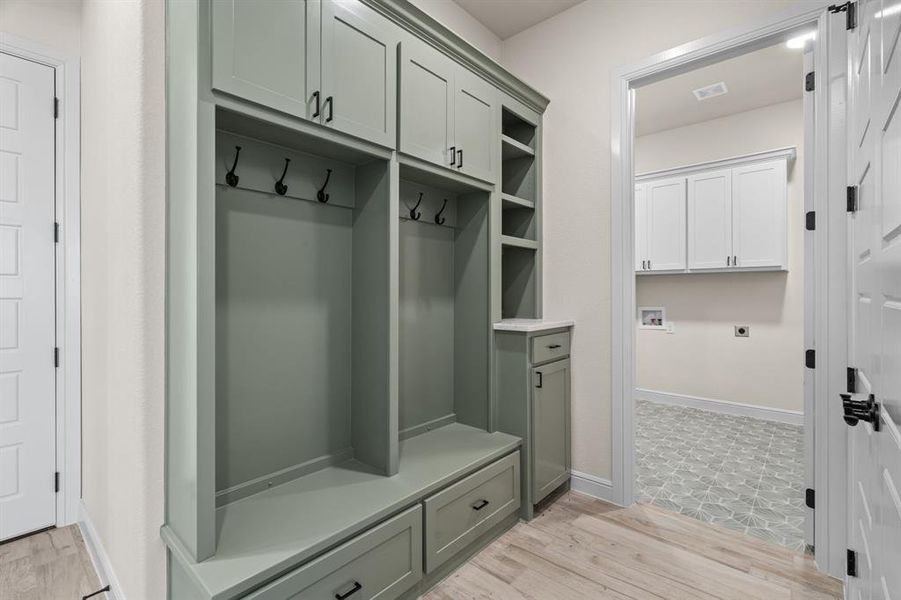 Mudroom with Built-In Cabinetry, Hooks and Drawers makes for great storage
