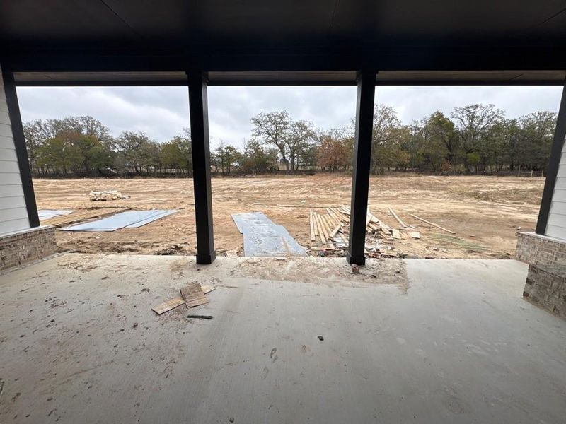 View of patio featuring view of scattered trees