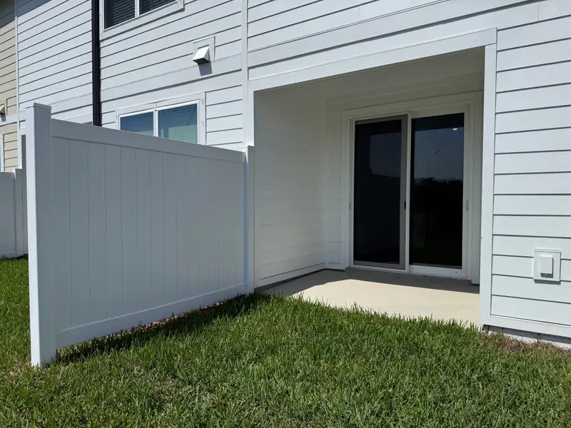 Private covered lanai at the back of the home