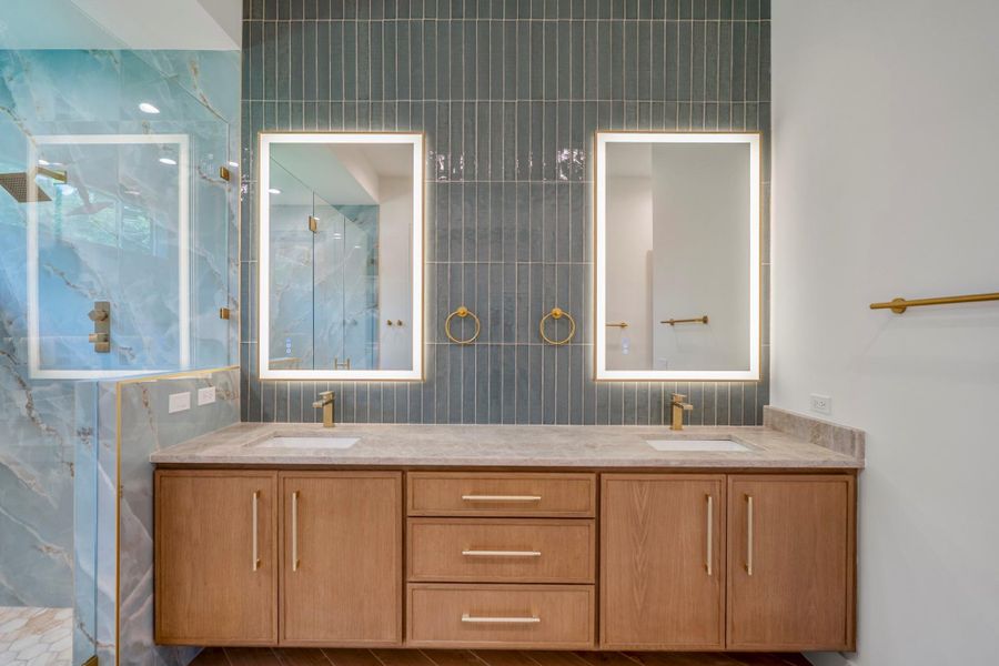 Beautiful floating white oak vanity with gorgeous Taj Mahal countertop and vertical tiled backsplash gives a sophisticated yet relaxing feel. Beautiful floating white oak vanity with gorgeous Taj Mahal countertop and vertical tiled backsplash gives a sophisticated yet relaxing feel.