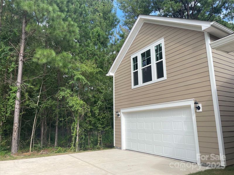 Rear, detached 2 car garage with finished bonus above that includes 1/2 bath and walk in storage Rear, detached 2 car garage with finished bonus above that includes 1/2 bath and walk in storage