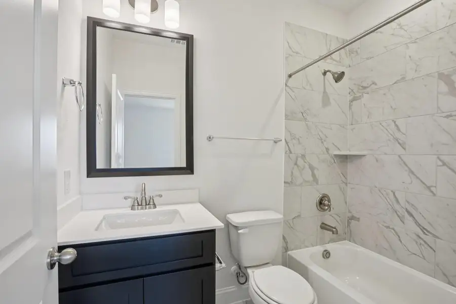 Furnished interior view inside a new home in Del Bello Lakes 60', Manvel (Image 13).