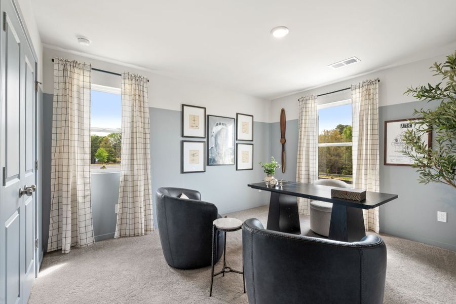 A room with a table chairs and a window with curtains. A room with a table chairs and a window with curtains.