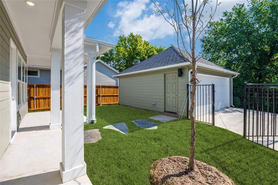 View of yard with a garage