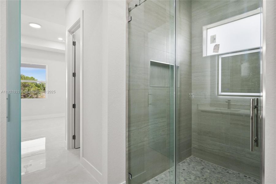 Full bathroom featuring a stall shower, vanity,and recessed lighting Full bathroom featuring a stall shower, vanity,and recessed lighting