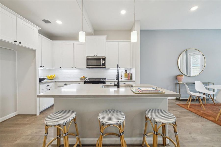 Kitchen island with extendedcountertop for comfortable seatingand entertaining.