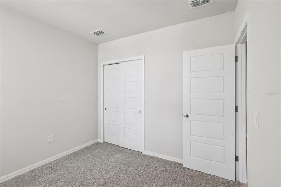 Spacious, unfurnished interior of a new home in Crescent Lakes - Premier Series, Punta Gorda (Image 29).