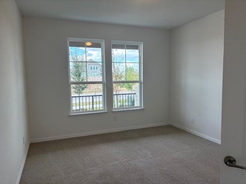 Spare room with light carpet Spare room with light carpet