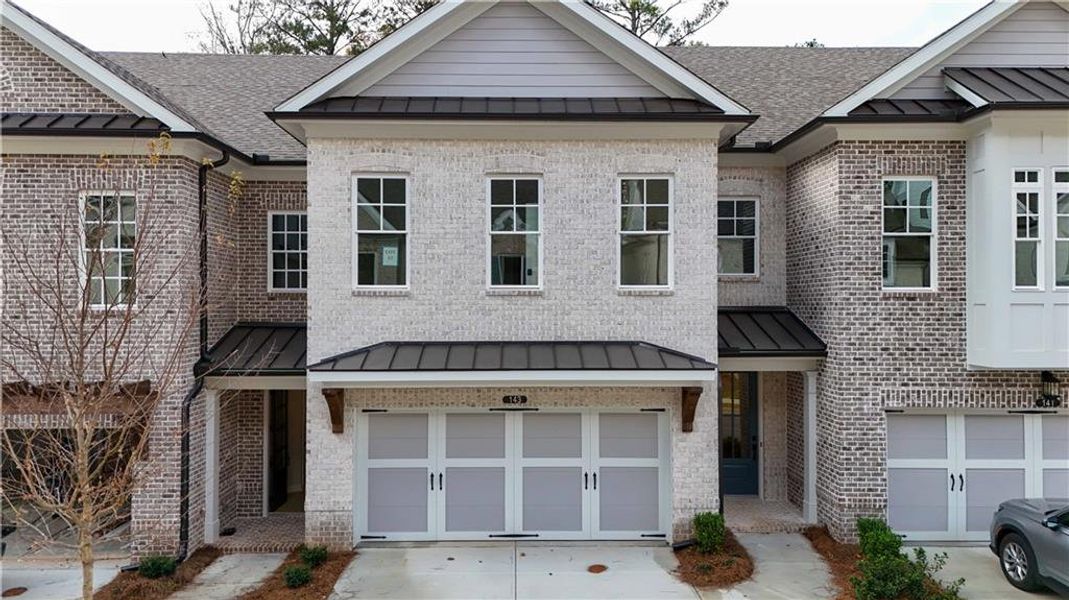 Front exterior of a new home in Ward's Crossing Townhomes, Johns Creek, GA, highlighting curb appeal (Image 52).